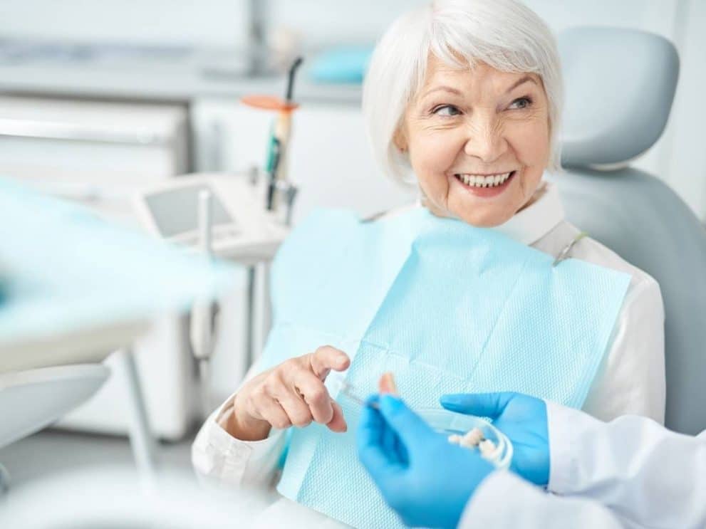A patient enjoying the benefits of dental implants for seniors in Benbrook, TX